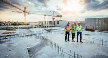 Construction management professional applying technology engineering on site