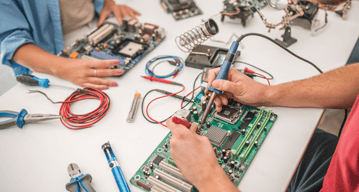 Electronics engineering science student working with circuits